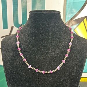 Faux Navajo pearl necklace with purple beads and smiley face beads